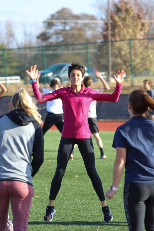 Adrienne Rockette does jumping jacks to get her heart rate up at practice after a long day at school.