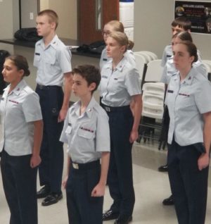 Freshman Lil Clay (center) stands at attention during a Civil Air Patrol meeting. 