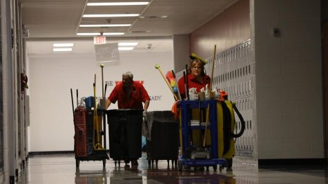 Night custodians Shawn Johnson and Jeff Risch make their way down the 200 hallway at 2:30 p.m. This is the start of their day until 11 p.m.