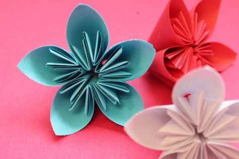 3D origami flowers in Libertys colors to be put on a banner for Board appreciation month.