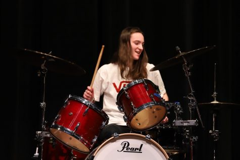 Katie Harrison performs an action-packed drumming piece. 