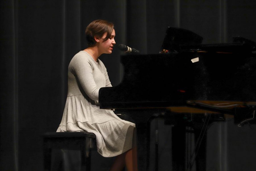 Morgan Feinstein masterfully plays a piano solo. 