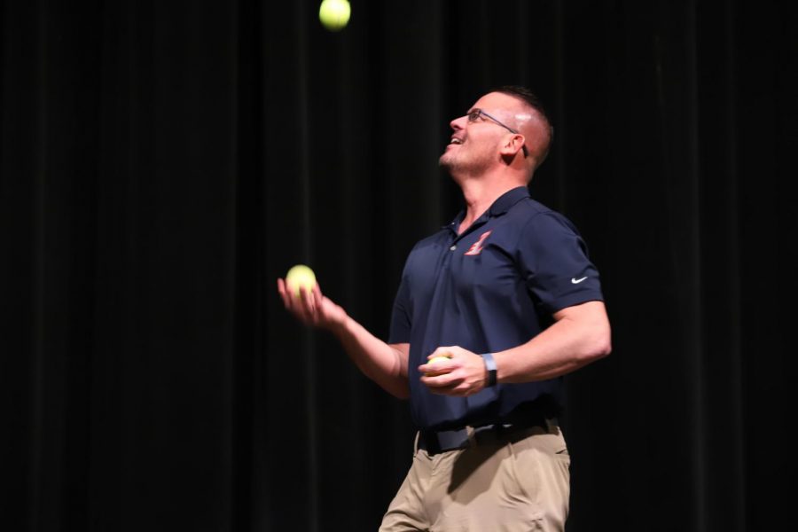 Mr. Nelson attempts to juggle tennis balls at the 2020 talent show.