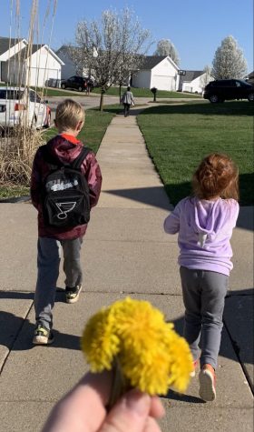 I go on a walk with my younger siblings. Gavin, 13, is way ahead of everyone else and carries Willows roller skates. Bently, 9, on the left carries waters in  our Blues bookbag. Willow, 5, on the right, tries her best to keep up with everyone. 
