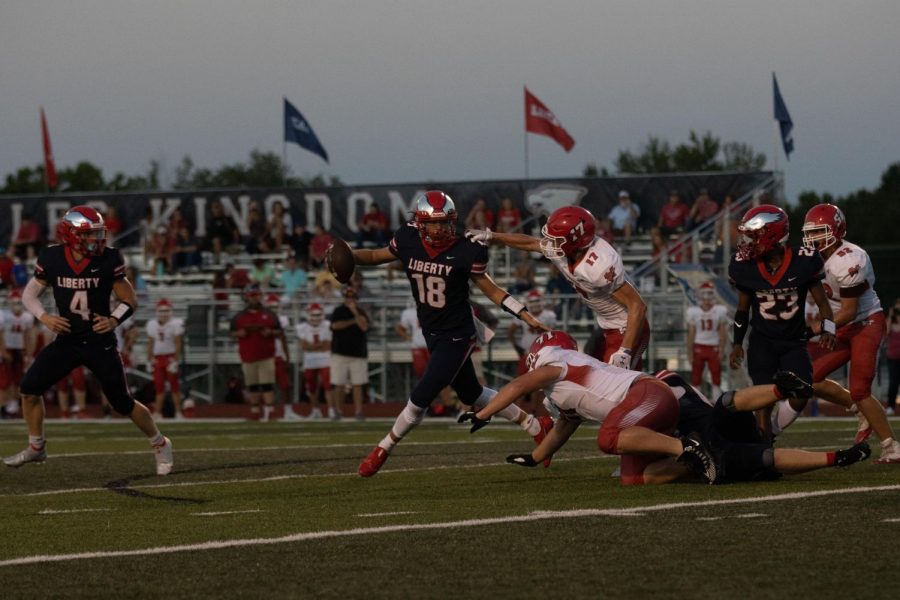 Quarterback Blake Seaton escapes tacklers on an option play.