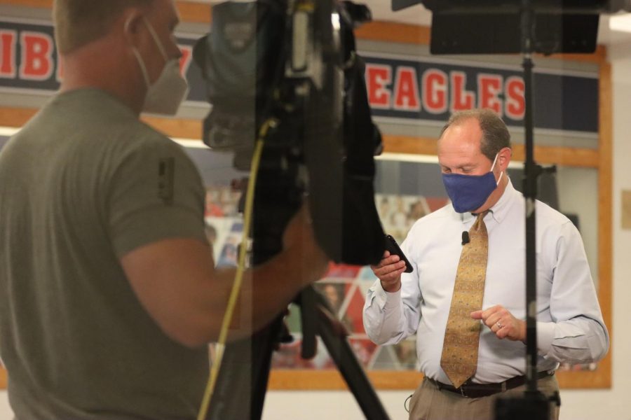 Fox 2 reporter Chris Regnier preps to film the first day of school at Liberty.