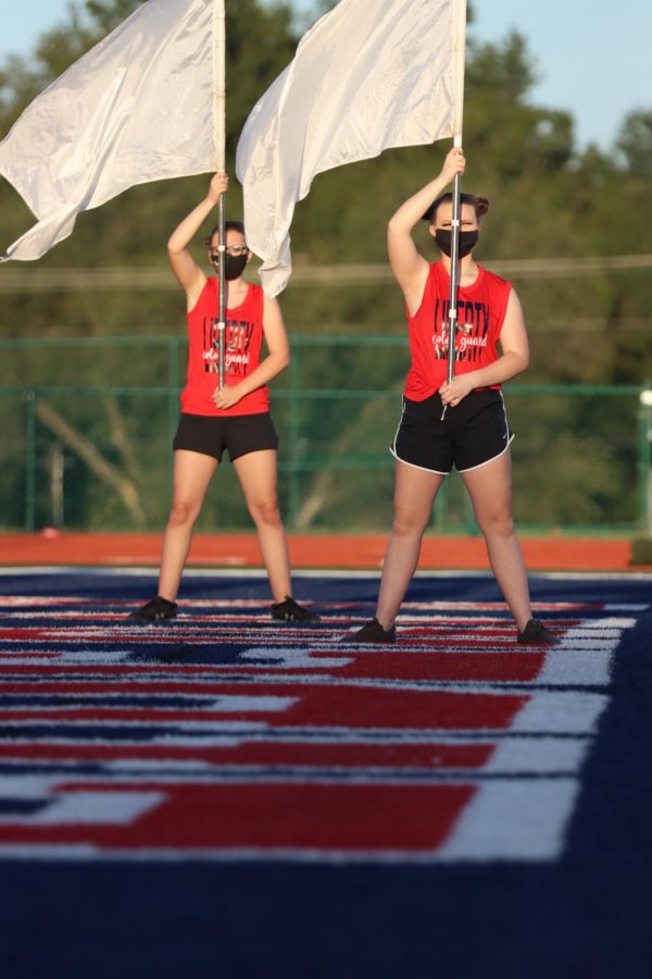The color guard team performs their routine as part of this season's show, One Small Step.