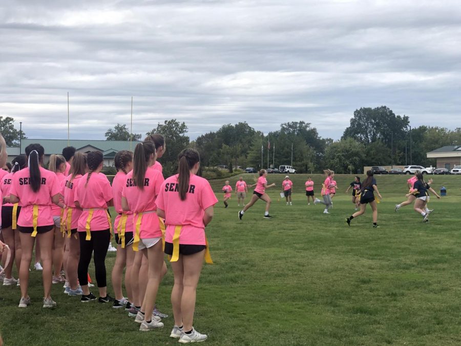 2019-2020+seniors+stand+on+the+sidelines%2C+cheering+on+their+teammates+at+last+years+powder+puff+game.