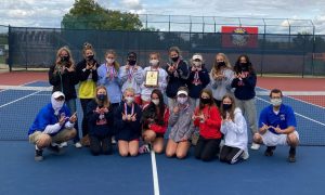 After winning the GAC North-Central Division championship, the girls tennis team show off their first place plaque and medals.