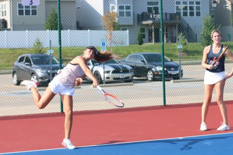 Freshman Isabella Gamm serves a shot at a practice earlier in the season.