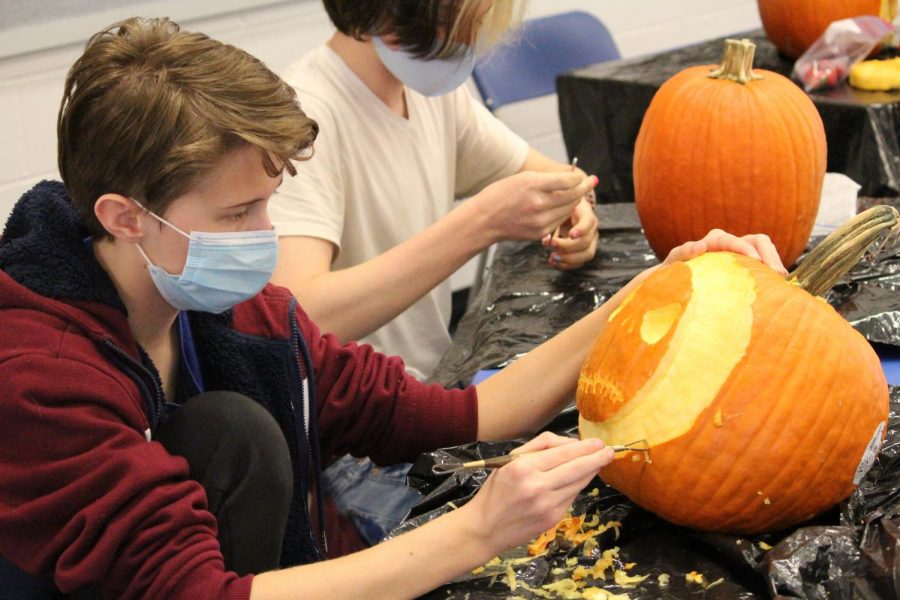 Amber Stein carves a Jack Skellington inspired pumpkin.