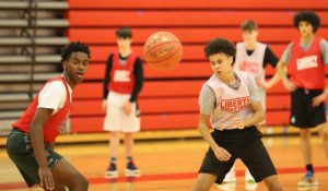 Jayden Betton and Connor Harris work on a drill in basketball practice on Tuesday, Nov. 17. Despite the district being at Level 3, after school activities such as winter sports are still taking place. 