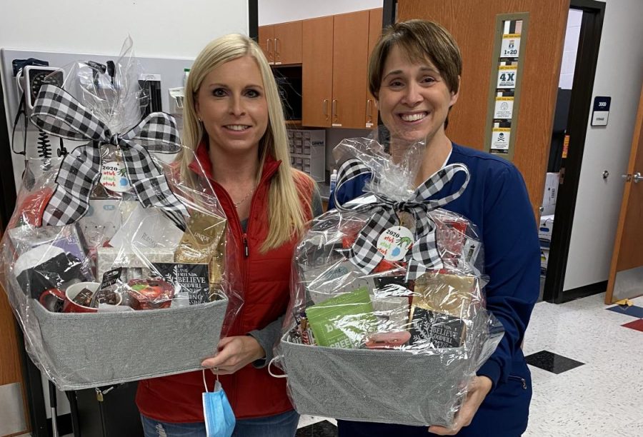 Marcey Watkins (right) and Bridget Thomason hold their baskets that the LHS staff presented to them, in appreciation of their work.