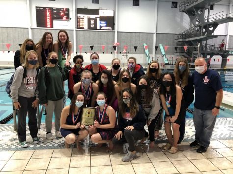 The girls swim and dive team celebrates their GAC championship on Feb. 10 at the Rec-Plex.