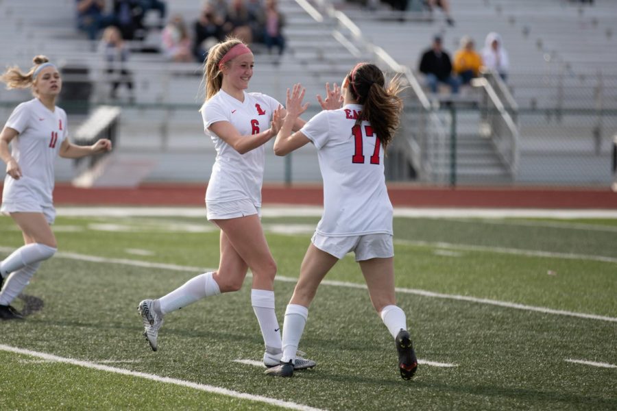 Maddie Lipp(6) celebrates a goal with Molly Link while Kyley Henry look on in a match against Fort Zumwalt West on March 22. The Eagles won 2-0.