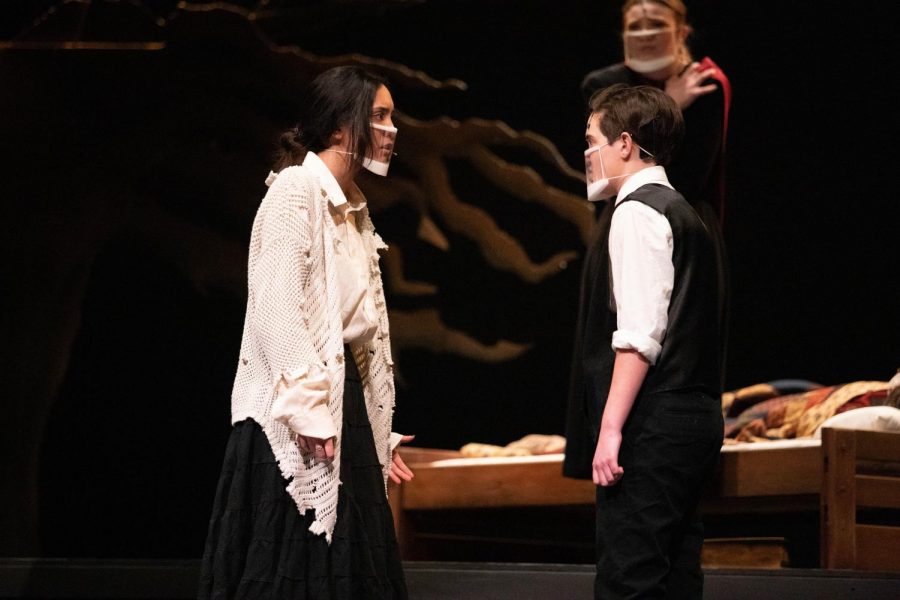 Tituba (Madeline Claravall) begs Reverend John Hale (Sean Bruce) to believe her innocence.