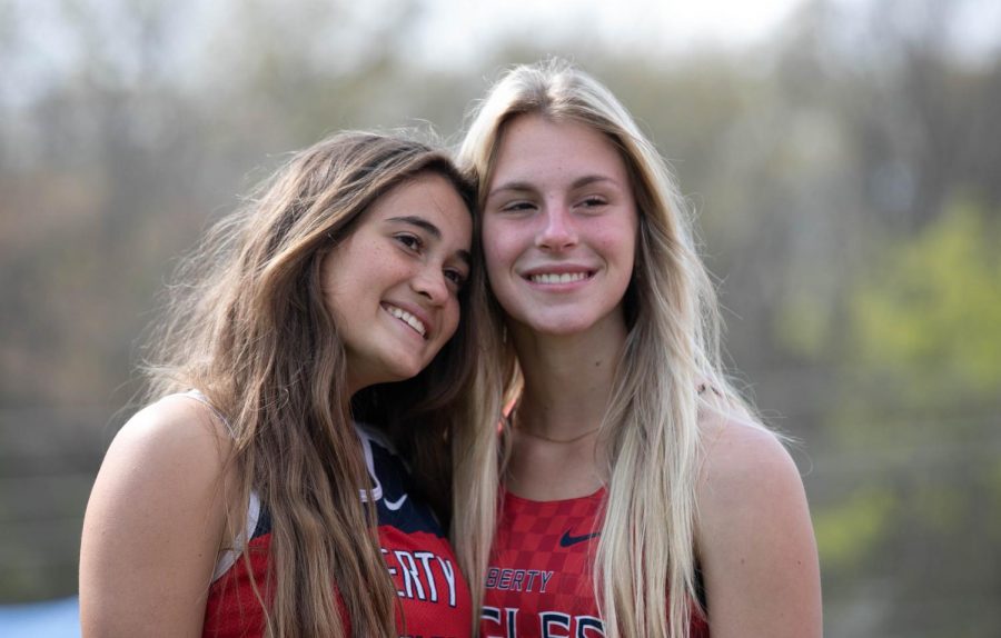Bella Gamm (9) and Marley Nelson (9) pose for a picture at the track meet. 