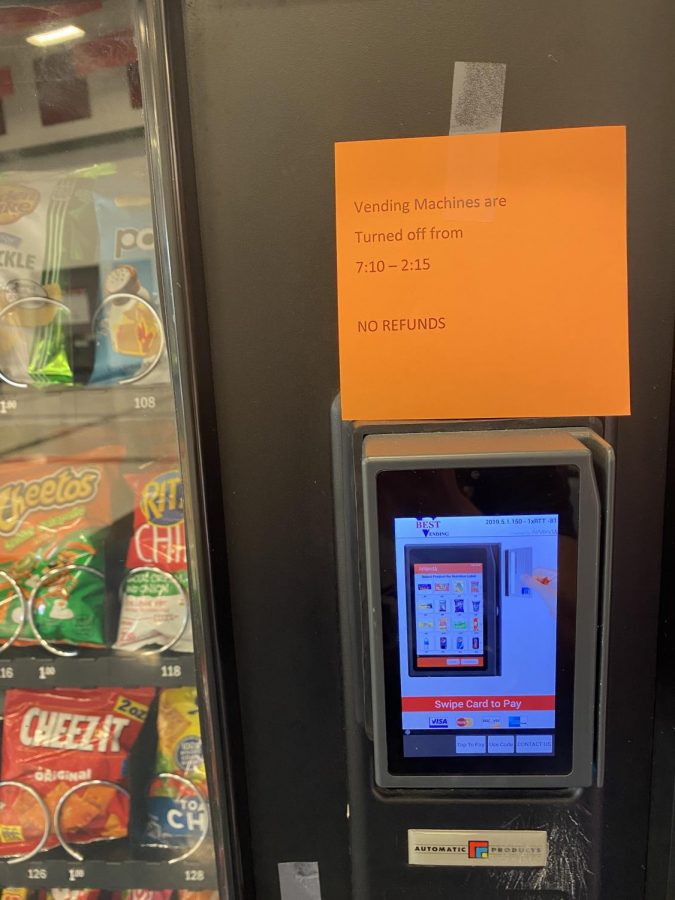 Notes are hung on the vending machines informing students of the new restrictions on the machines set by Dr. Nelson