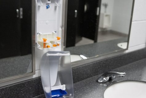 A bathroom soap dispenser was found with the container of soap licked out of it.