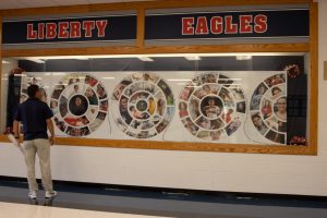 Mr. Glavin takes a look at the school mural at the entrance of the school. 