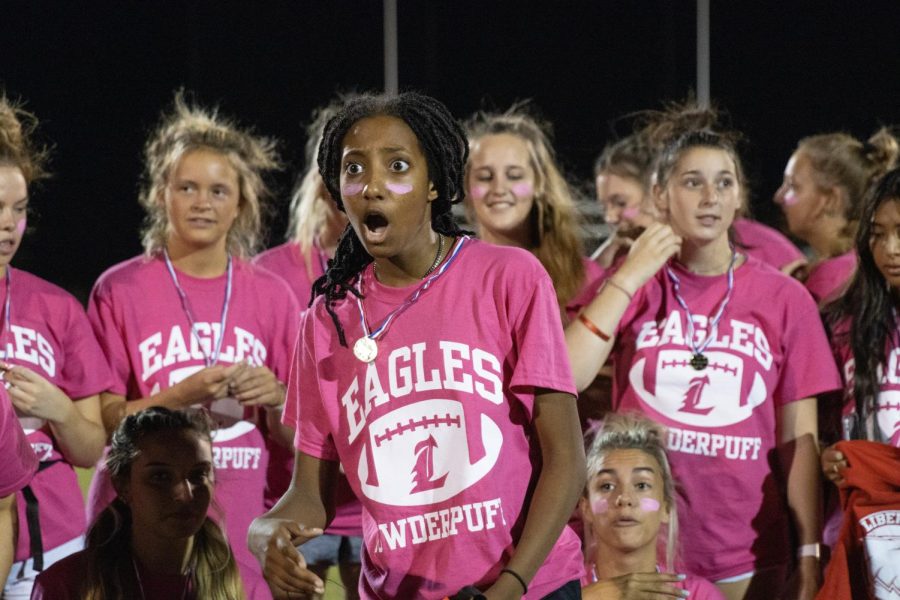 Senior Jadyn Smith encourages the sidelines to cheer for their teammates on the field.