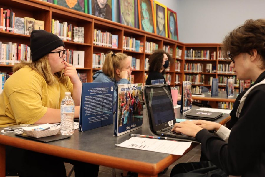 Students work on college application process in the library on Tuesday. 