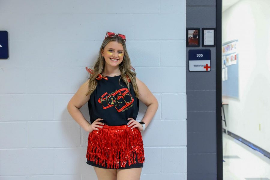 Aubrey Kress in Fridays theme of red, black, and gold.