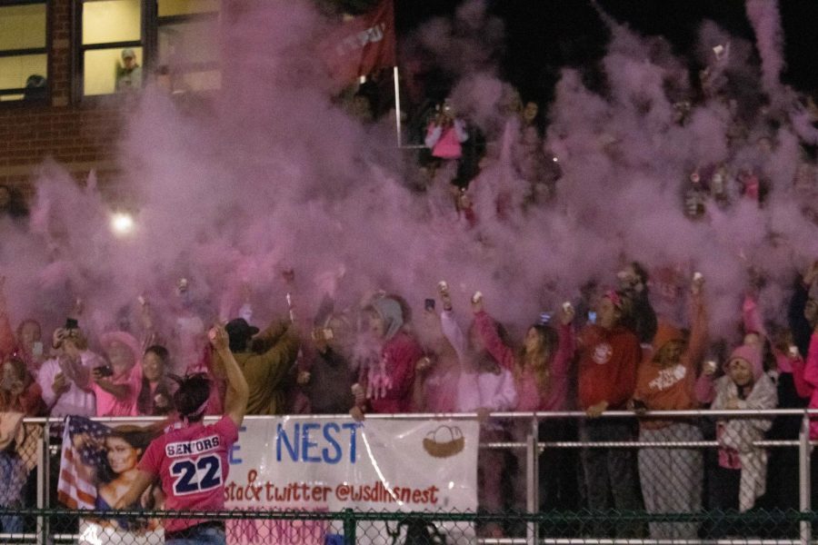Student Council lead the annual throwing of the pink powder for breast cancer awareness at halftime of the FZN game.