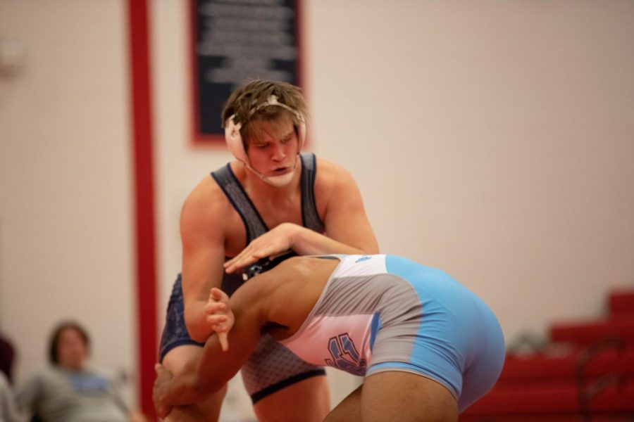 Matt Craig tussling in a match against a St. Charles player on Jan. 13.