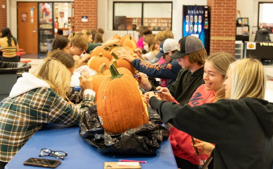 Sculpture students work on their pumpkin creations during lunch. 