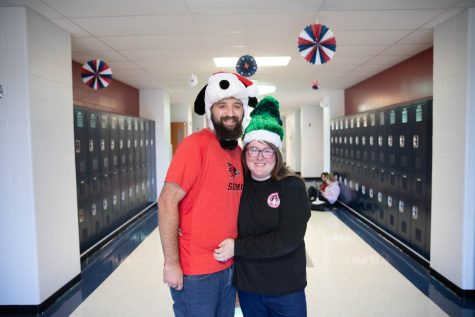 The Sachs take part in Holiday Spirit week by wearing Christmas hats.