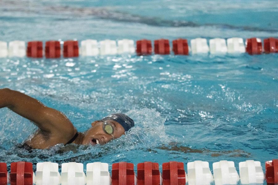 Leilani Green (10) focuses on her movement and breathing during a swim meet. 