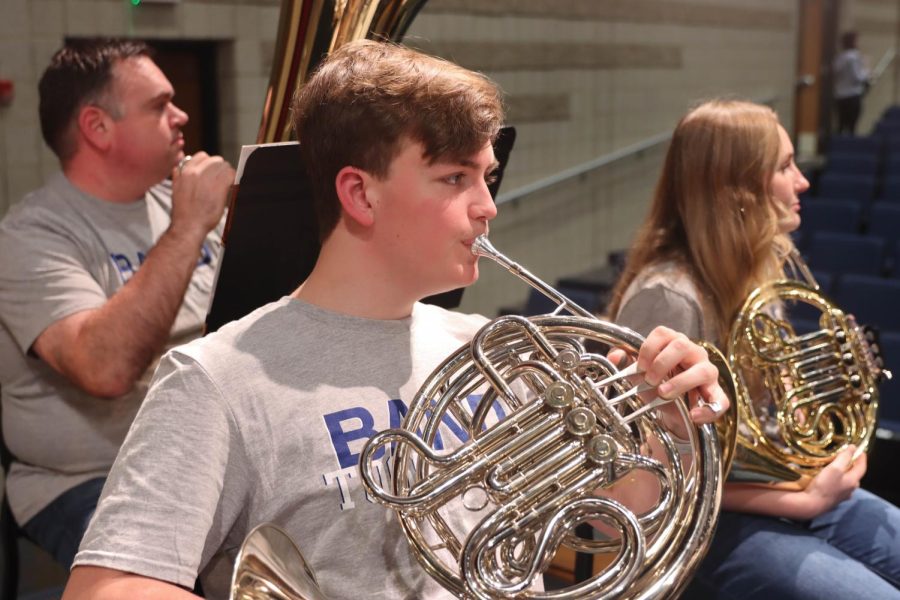 Junior AJ Fruehwirth plays his french horn in the WSD Community Band.