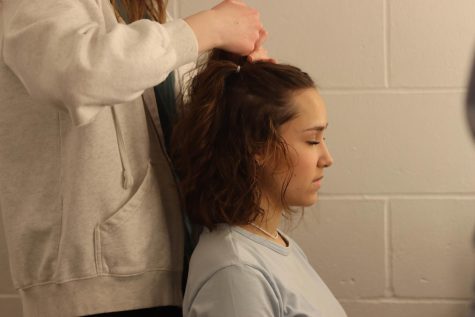 Morgan Feinstein (11) has her hair done by Brynn Bartram (12). Morgan Feinstein says that she is always trying to keep busy with shows, being that theatre is her passion. I didnt skip a beat jumping to new things, Feinstein said.