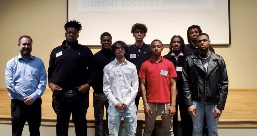 Men from Liberty gathered around for a photo at the Men of Color Success Summit at St. Charles Community College. 