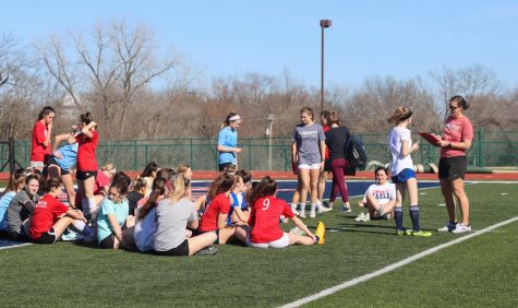 varsity coach kleekamp gives her athletes instructions/tips on the second day of spring sports practice.