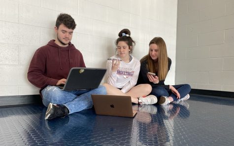 Seniors Keaton Roof, Ally Schniepp and Brynn Bartram study and prepare for the Seal of Biliteracy test.