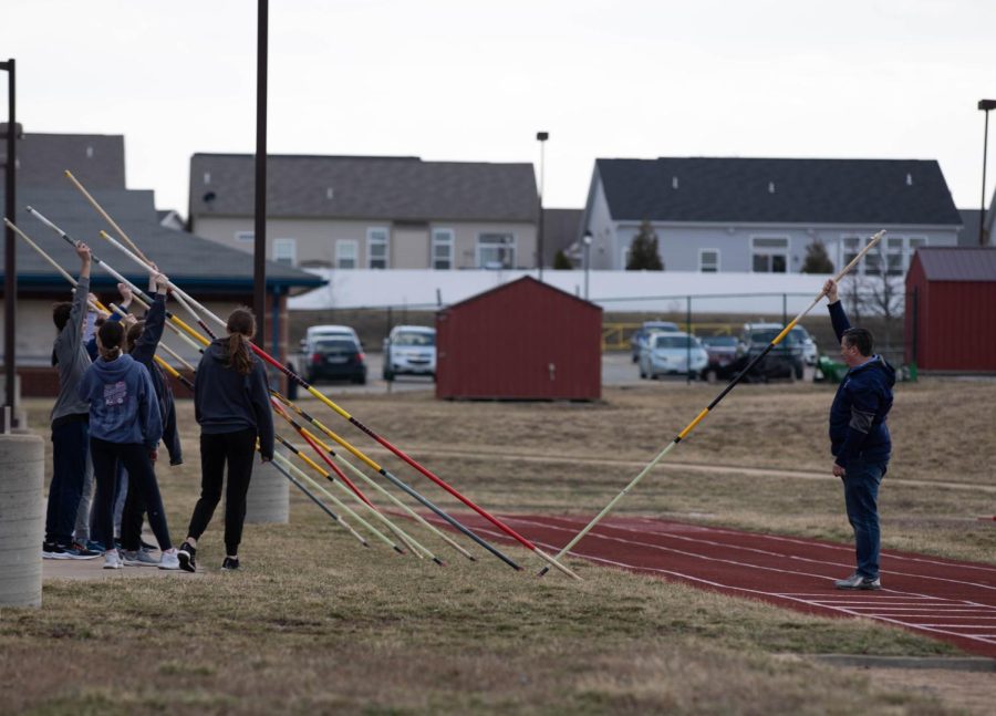 Frontier Middle School pole vaulters prepare to begin practice. 