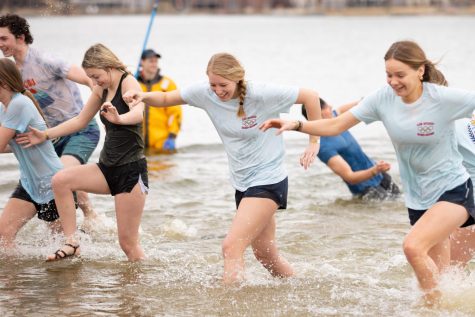 Student Council members Maddie Ashlock (12), Anna Hillgartner (11), and Allie Quirk (11), plunge into the Lake St. Louis lake in support of the Missouri Special Olympics.