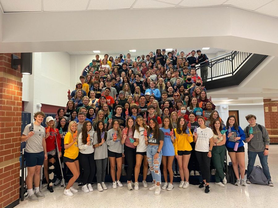 Seniors gathered for a picture during seventh hour for Decision Day. Many seniors wore attire of where they will be attending next year. 