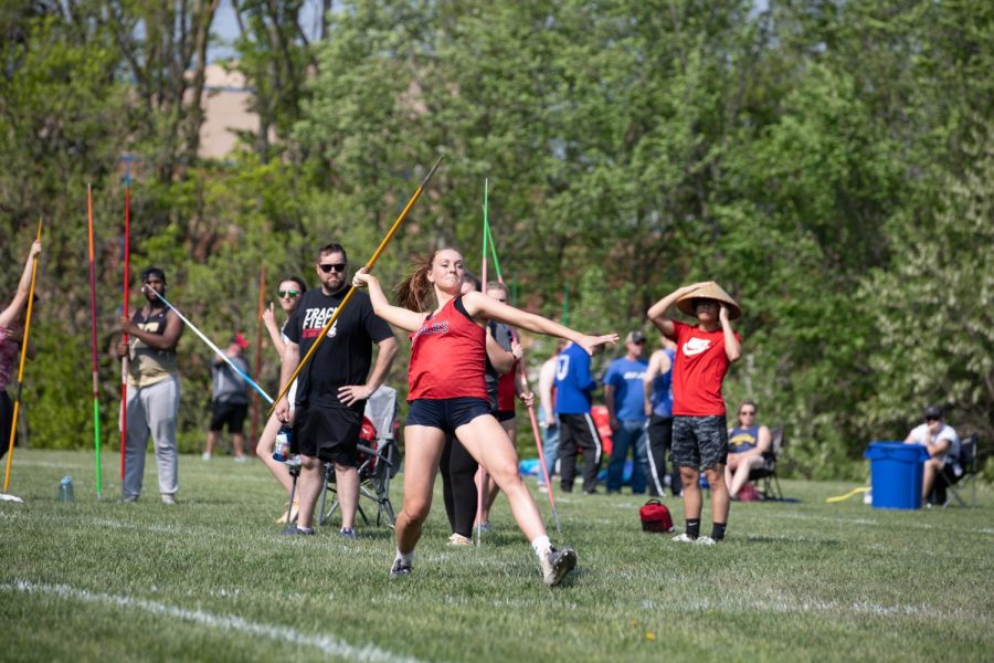 Savannah Meyer (11) steps to throw a javelin. Meyer placed third overall at the district meet. 