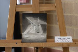 Senior Brennan Myers drawing was put on display on an easel for all to see at the art and fashion show put on by teachers. 
