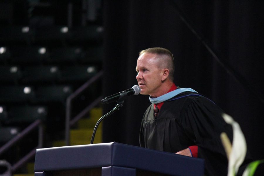 Mr. Jolliff begins his speech after doing the “Griddy” to the podium. Jolliff was voted to be the teacher speaker this year at graduation. “Education to me is about relationships. Those strong bonds with students that will forever hold a special place in our hearts,” Jolliff said during the speech. 