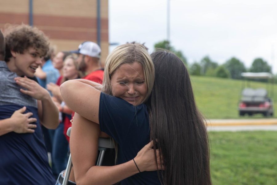 Hailey Jolliff receives a hug from her mom, Mrs. Jolliff. 