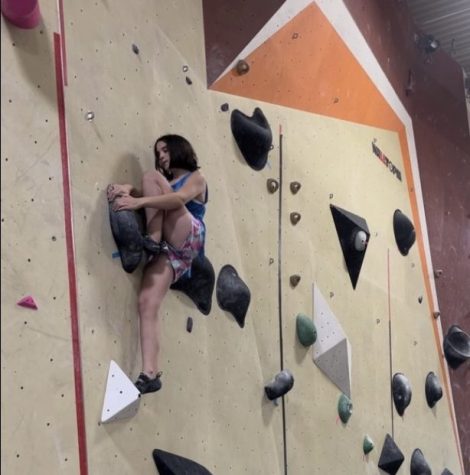 Kate Broussard climbs on a level V6 wall at Upper Limits in Chesterfield. 
