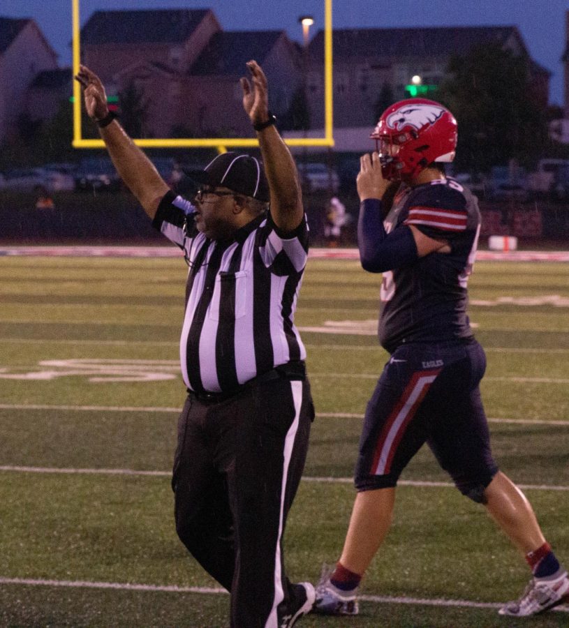 The referee signals a touchdown in the Liberty vs. Holt game on Sept. 2.
