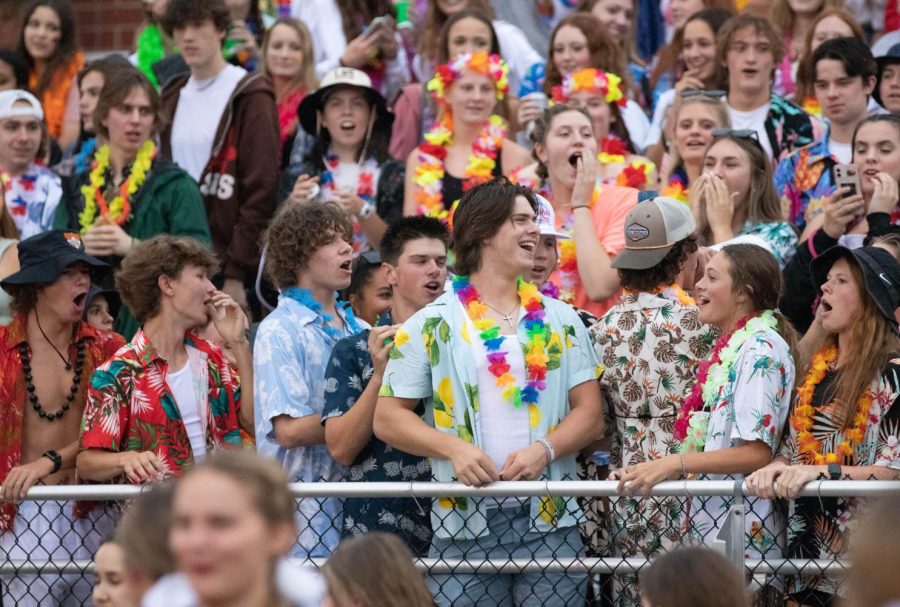 Libertys luau themed student section cheers the team on right before halftime. 