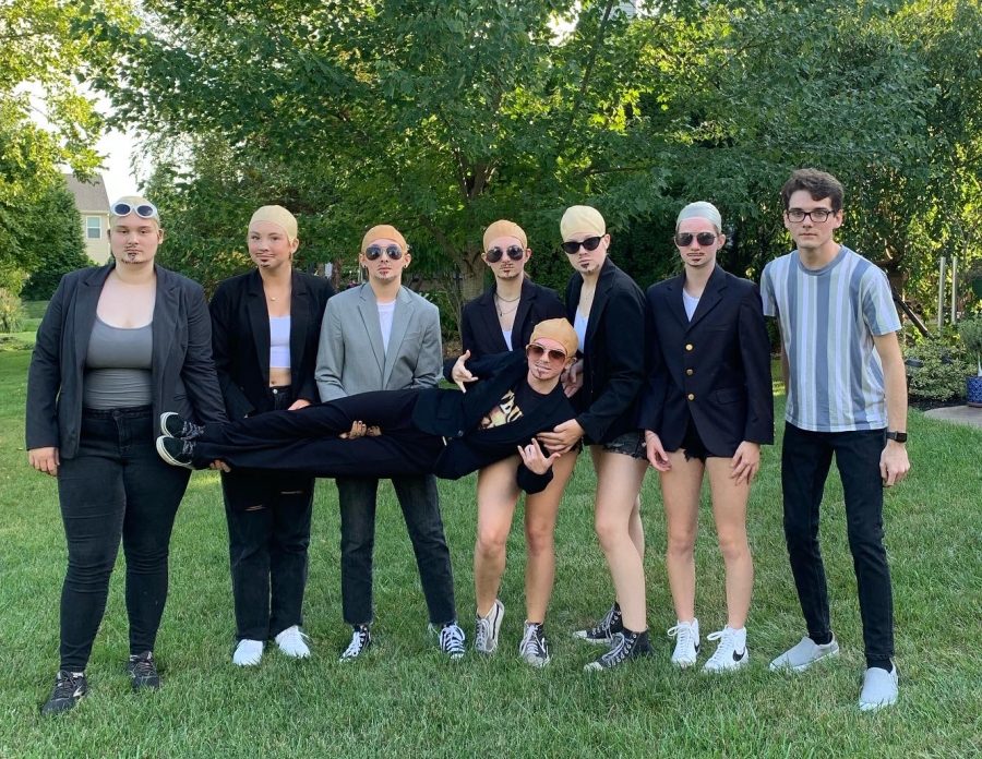 Liberty Students dressed at Pitbull (from left to right, Maddie Gamache (12), Sydney Eilermann (10), Alix Queen (12), Julia Wiley(12), Kylie Pashia, Lauren Wiley (10), Rhett Cunningham (12), and laying across Natalie Hoffman (12).)
