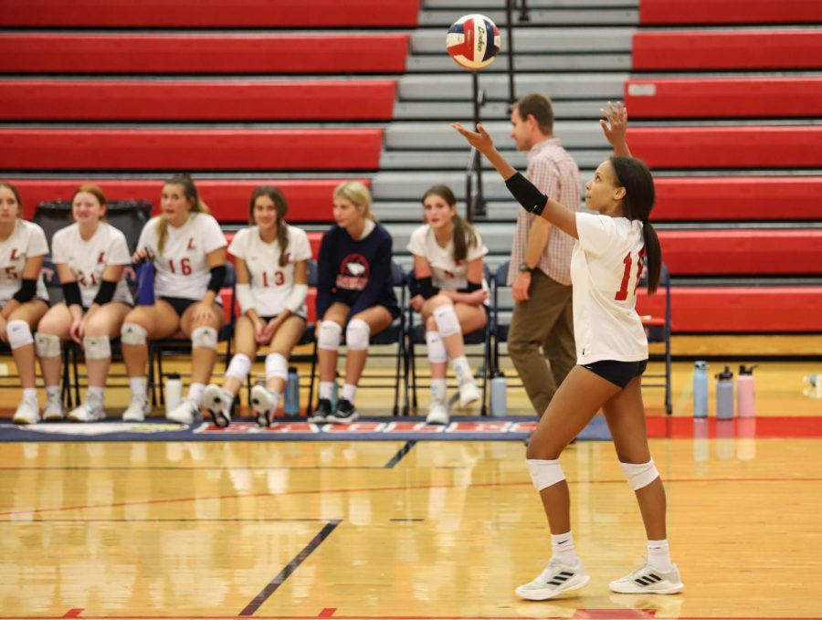 Kenna Harris serves the ball in the game against Timberland. 