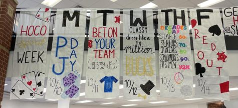 The spirit week day banners on display in the cafeteria. 